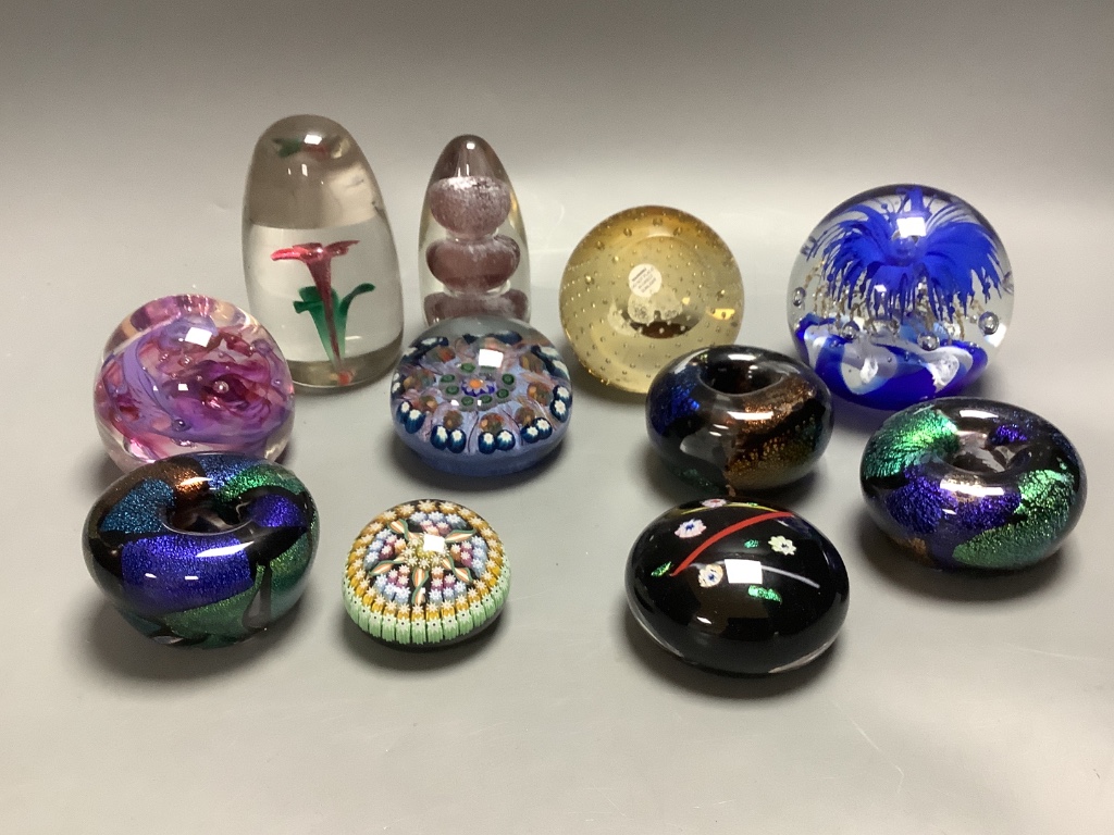 Eleven glass paperweights